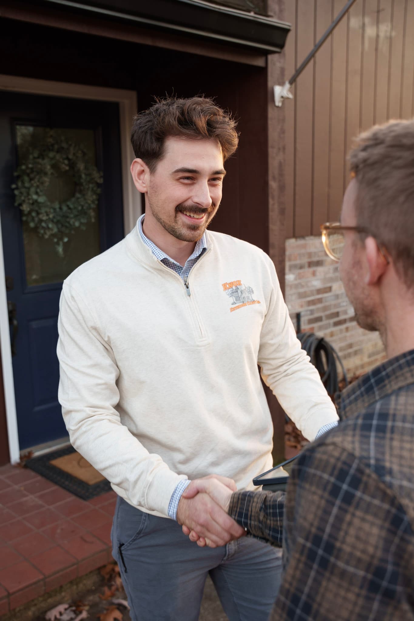 Knox Exterior Care Co. founder shaking hands with a client