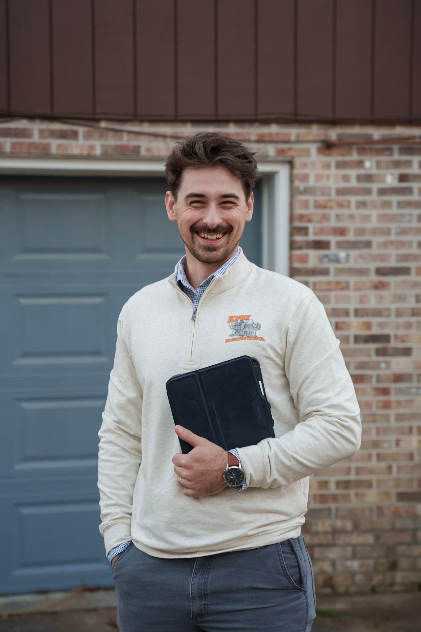 Nicholas Dunn, founder of Knox Exterior Care Company, outside a Knoxville property